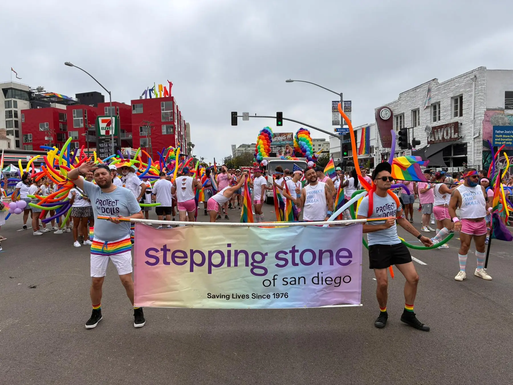 Stepping Stone marchers carrying the banner down the San Diego Pride parade route